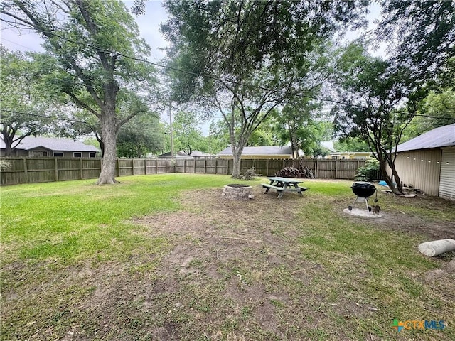 212 Whitfield St, Yoakum, TX 77995 - view of yard featuring a fire pit