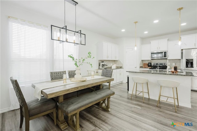 dining room featuring light hardwood / wood-style flooring