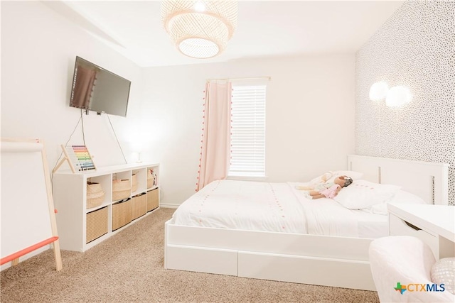 bedroom featuring light colored carpet