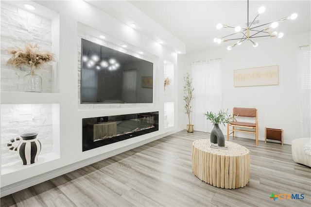 living room featuring hardwood / wood-style floors and an inviting chandelier