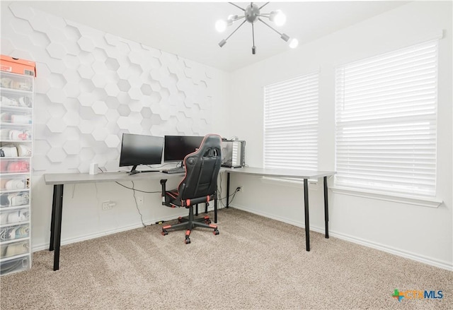 office space featuring light colored carpet and a chandelier