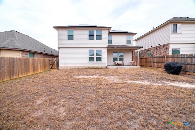 rear view of house with a patio area