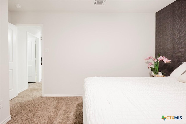 unfurnished bedroom featuring light carpet