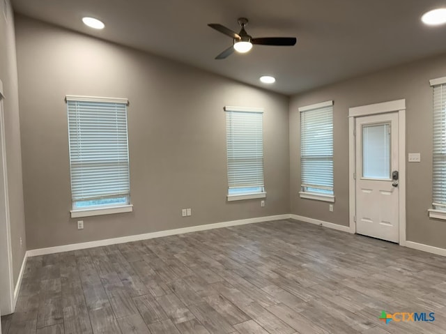 spare room featuring ceiling fan and light hardwood / wood-style floors