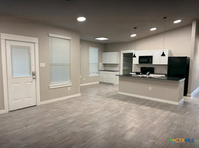 kitchen with pendant lighting, black appliances, decorative backsplash, light wood-type flooring, and white cabinetry