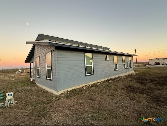 view of property exterior at dusk