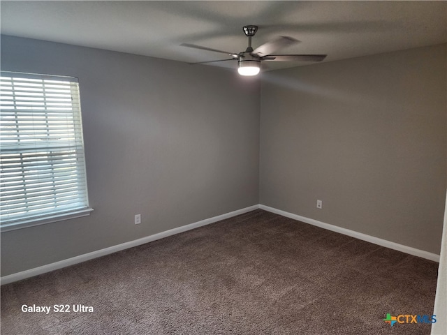 empty room featuring carpet and ceiling fan