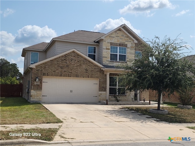 view of front of property with a garage