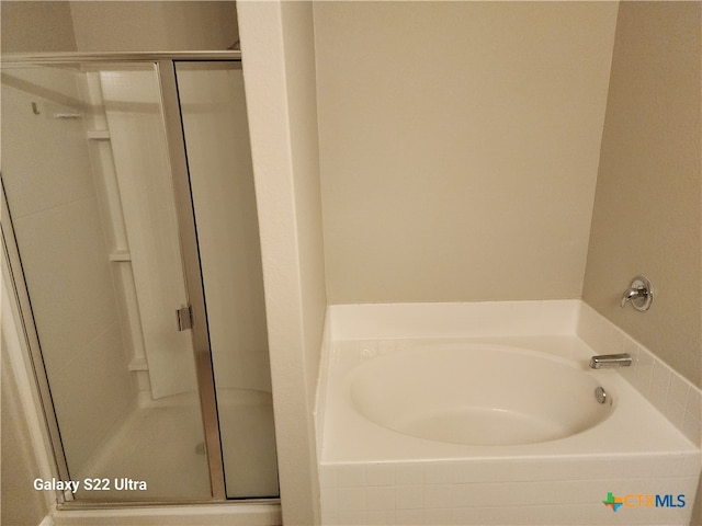 bathroom featuring plus walk in shower