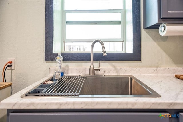 40 Sailfish Lndg, Port Lavaca, TX 77979 - kitchen view of a sink, a textured wall, and light countertops