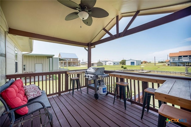 40 Sailfish Lndg, Port Lavaca, TX 77979 - wooden terrace with a residential view, ceiling fan, a grill, and a yard