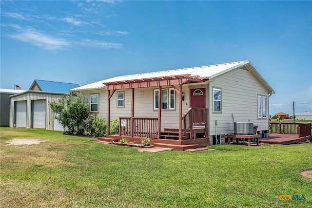 40 Sailfish Lndg, Port Lavaca, TX 77979 - back of house featuring cooling unit, a wooden deck, a yard, metal roof, and a pergola