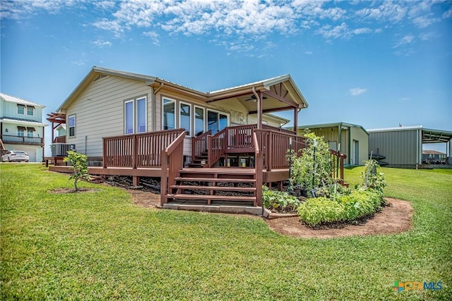 40 Sailfish Lndg, Port Lavaca, TX 77979 - back of house with a deck, a yard, an outbuilding, and central air condition unit