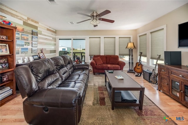 40 Sailfish Lndg, Port Lavaca, TX 77979 - living room with plenty of natural light, a ceiling fan, and light wood-type flooring