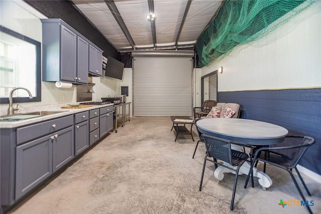 40 Sailfish Lndg, Port Lavaca, TX 77979 - kitchen with a sink, concrete floors, gray cabinets, and light countertops