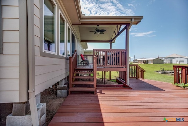 40 Sailfish Lndg, Port Lavaca, TX 77979 - wooden deck with ceiling fan, stairs, and a yard
