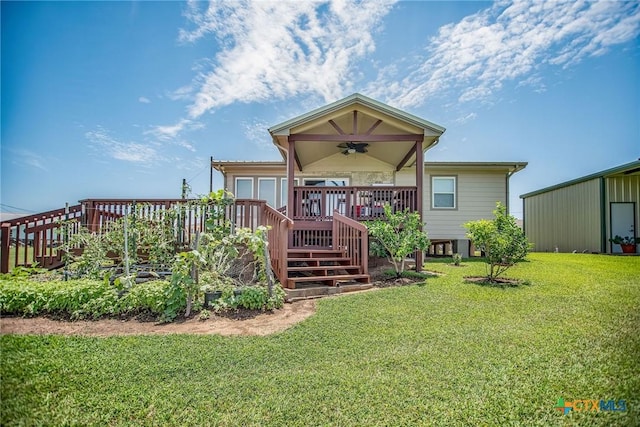 40 Sailfish Lndg, Port Lavaca, TX 77979 - rear view of house featuring ceiling fan, a lawn, a wooden deck, and stairway