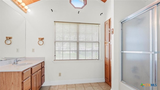 1309 E Zipp Rd, New Braunfels, TX 78130 - bathroom with vanity, tile patterned floors, baseboards, and enclosed tub / shower combo