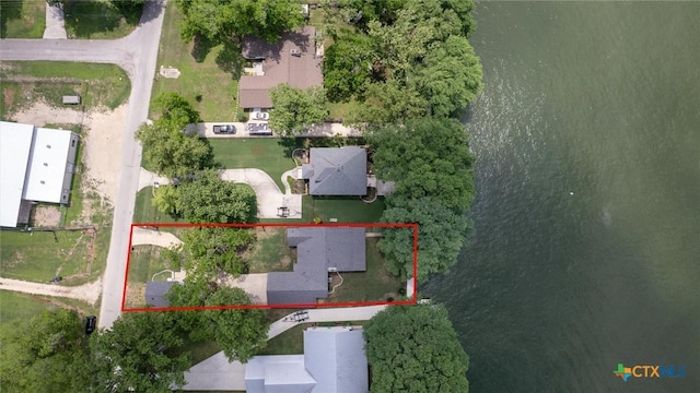 birds eye view of property with a water view