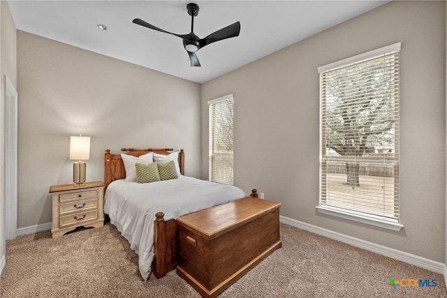 bedroom featuring carpet floors, ceiling fan, and baseboards