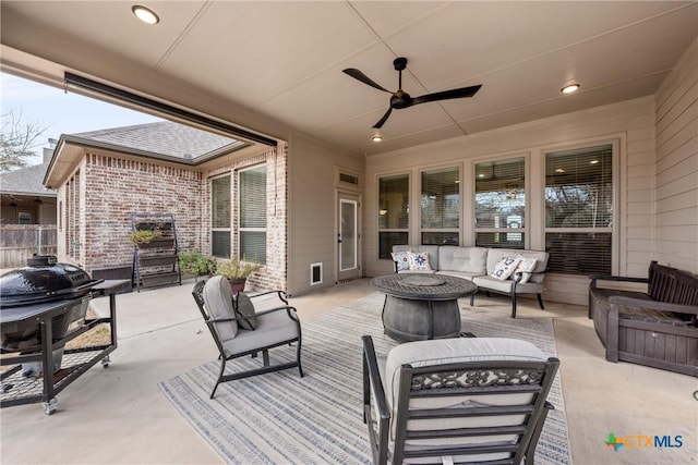 view of patio / terrace featuring a grill, fence, an outdoor hangout area, and a ceiling fan