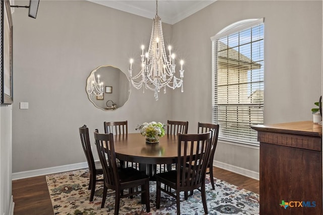 dining room with ornamental molding, a wealth of natural light, and dark wood-style flooring