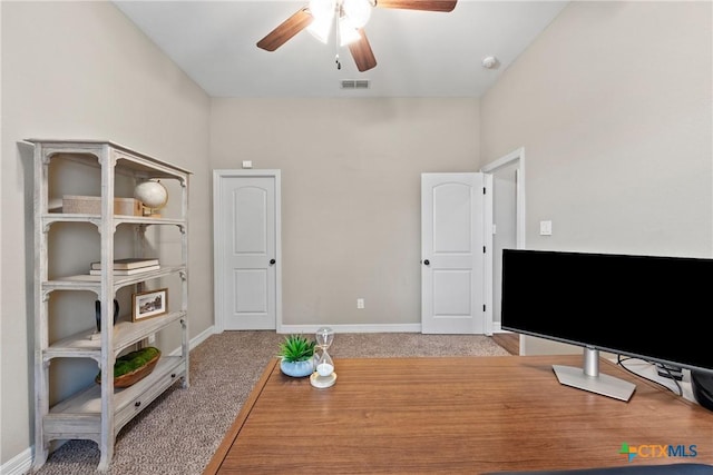 interior space with light carpet, ceiling fan, visible vents, and baseboards