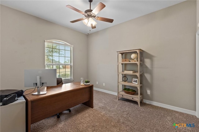 office area featuring a ceiling fan, carpet, and baseboards