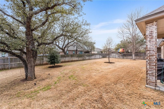 view of yard with a fenced backyard