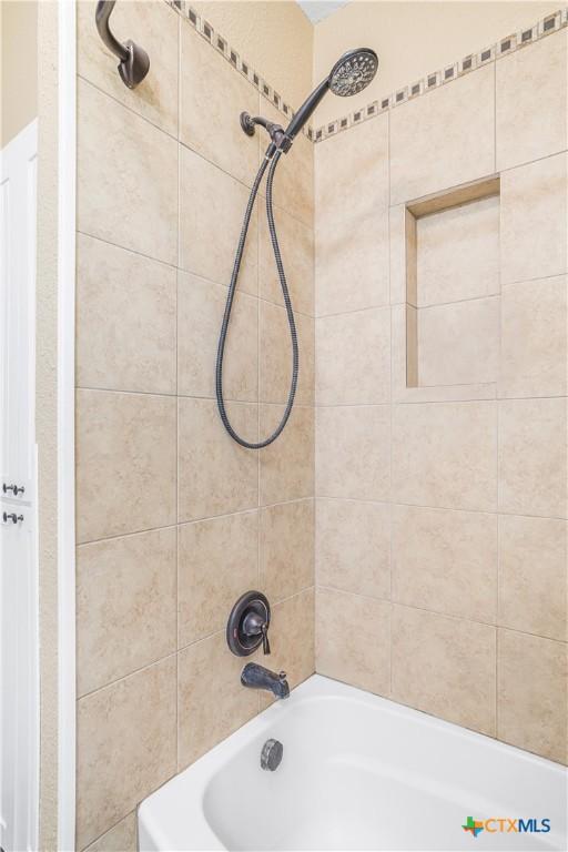 124 County Road 356b, Shiner, TX 77984 - bathroom featuring tub / shower combination