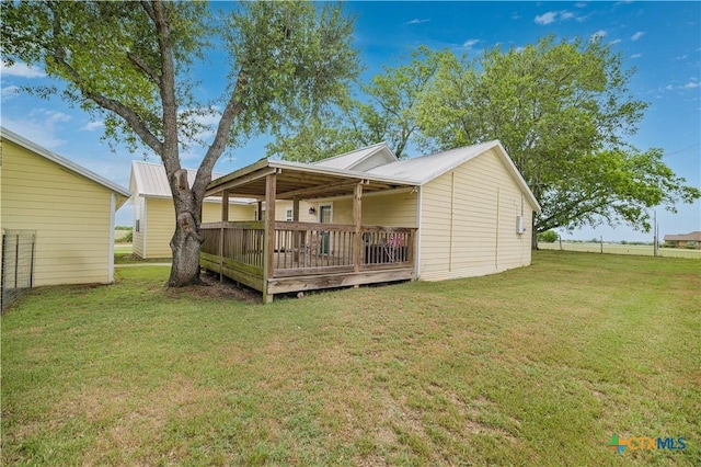 124 County Road 356b, Shiner, TX 77984 - back of house with a yard and a deck