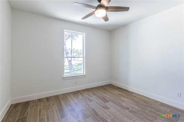 empty room with light hardwood / wood-style floors and ceiling fan