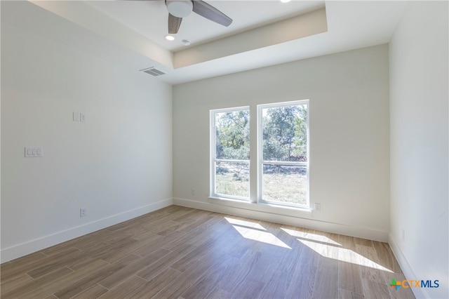 unfurnished room featuring hardwood / wood-style flooring and ceiling fan