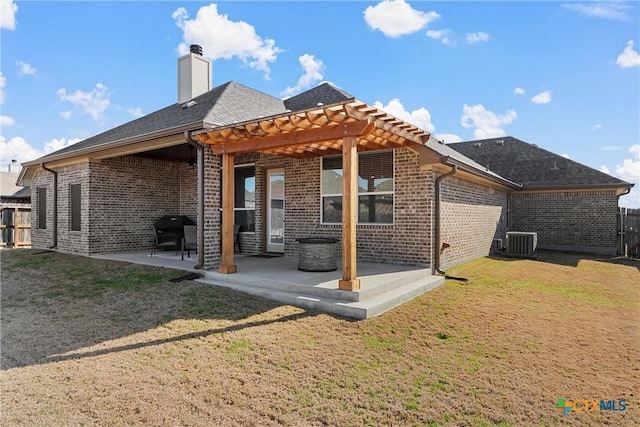 rear view of house featuring central AC, brick siding, a pergola, a chimney, and a patio area