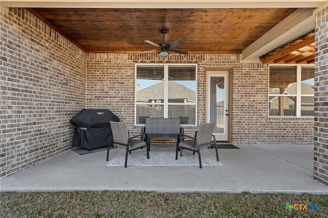 view of patio with ceiling fan and grilling area