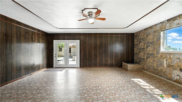 162 Lone Oak St, Seguin, TX 78155 - unfurnished room with wood walls and a ceiling fan