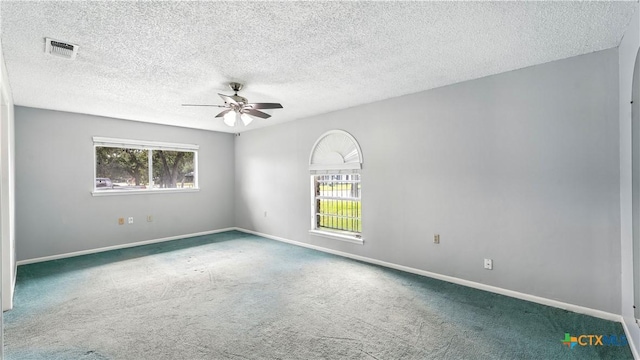 162 Lone Oak St, Seguin, TX 78155 - spare room with a ceiling fan, carpet, and a textured ceiling