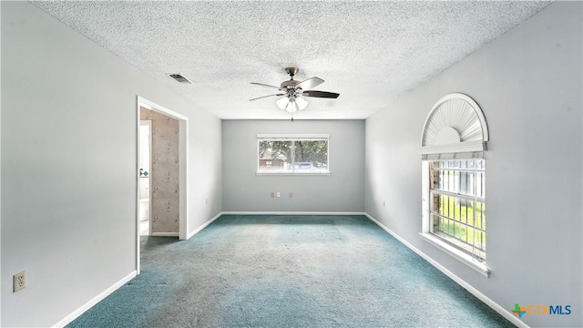 162 Lone Oak St, Seguin, TX 78155 - empty room featuring carpet flooring, a ceiling fan, and a textured ceiling