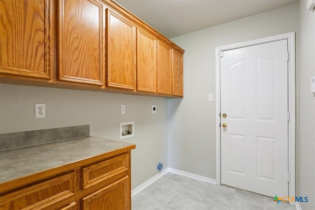 6809 Oak Vw, Belton, TX 76513 - laundry area featuring cabinet space, electric dryer hookup, and hookup for a washing machine