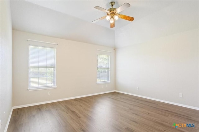6809 Oak Vw, Belton, TX 76513 - unfurnished room featuring wood finished floors, ceiling fan, and vaulted ceiling