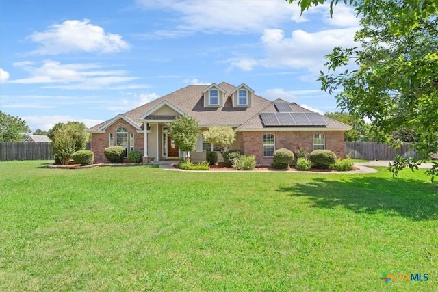 6809 Oak Vw, Belton, TX 76513 - view of front facade with solar panels and brick siding