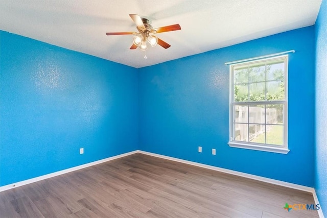 6809 Oak Vw, Belton, TX 76513 - unfurnished room featuring wood finished floors and ceiling fan