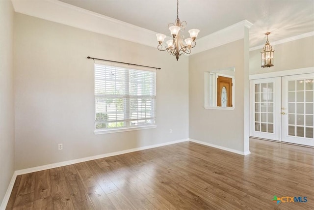 6809 Oak Vw, Belton, TX 76513 - unfurnished room featuring a chandelier, french doors, wood finished floors, and ornamental molding
