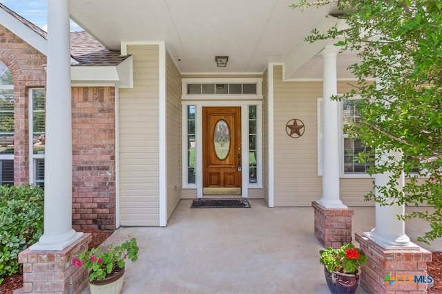 6809 Oak Vw, Belton, TX 76513 - entrance to property featuring covered porch, roof with shingles, and brick siding