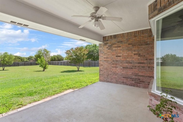 6809 Oak Vw, Belton, TX 76513 - fenced backyard with ceiling fan and a patio area