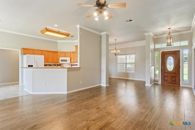 6809 Oak Vw, Belton, TX 76513 - unfurnished living room with a chandelier, ceiling fan, crown molding, and light wood-type flooring