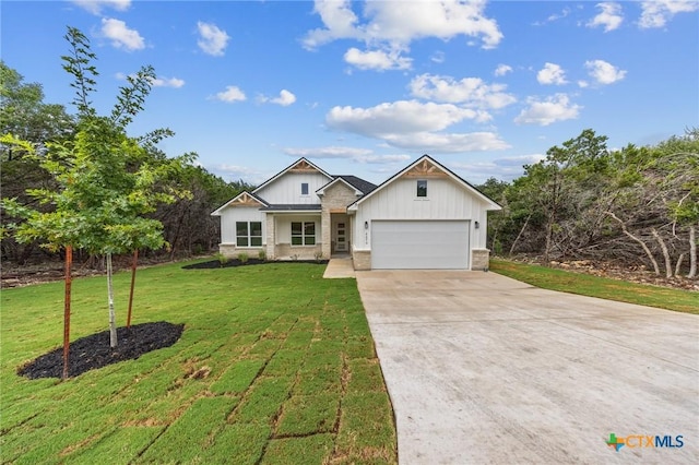 5273 Comanche Dr, Temple, TX 76502 - modern farmhouse featuring driveway, a front yard, board and batten siding, and an attached garage