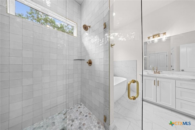 5273 Comanche Dr, Temple, TX 76502 - bathroom with vanity, a shower stall, and a freestanding tub