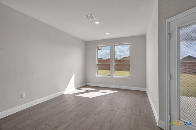 spare room featuring light wood-type flooring