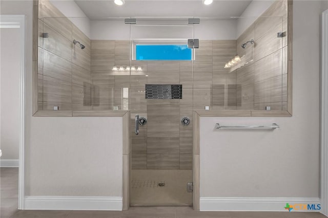 bathroom with tile patterned flooring and a shower with shower door